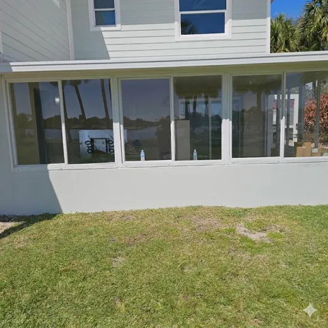 Exterior view of Screen room that is attached to the unfinished 1 bedroom suite.