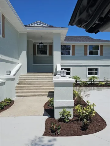 Closer view of front of home with parking pad