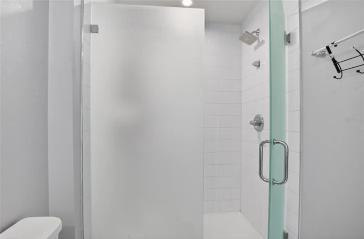 PRIMARY BATH WITH UPGRADED GLASS ENCLOSED SHOWER