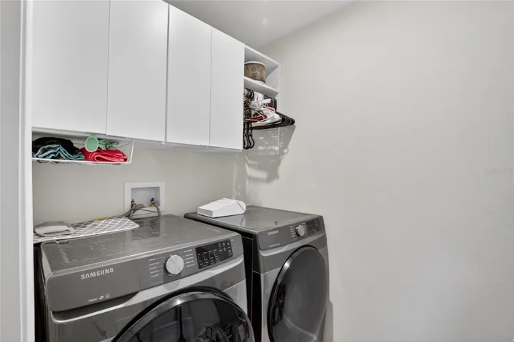 LAUNDRY ROOM WITH CUSTOM CABINETRY
