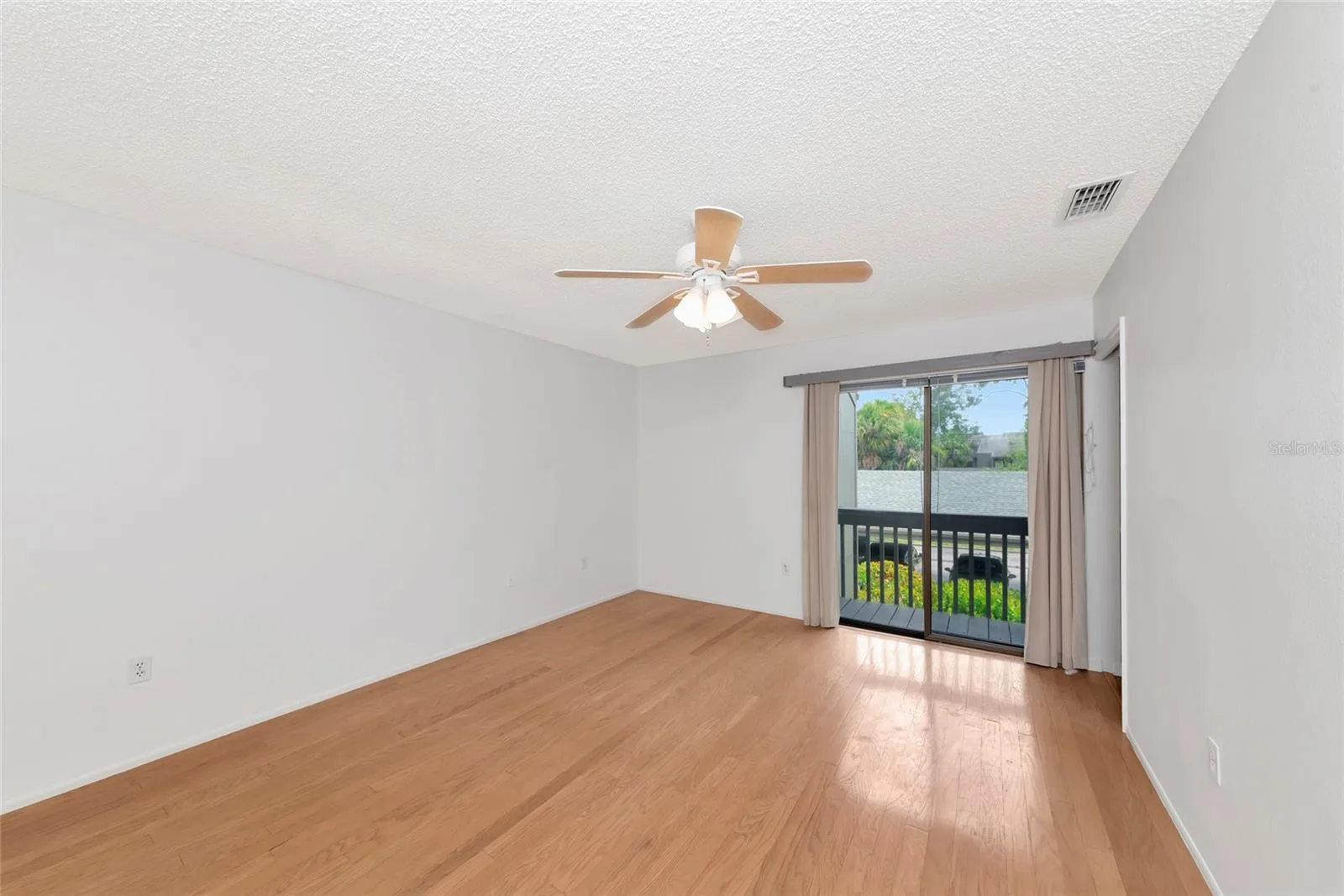 Primary Bedroom with Balcony