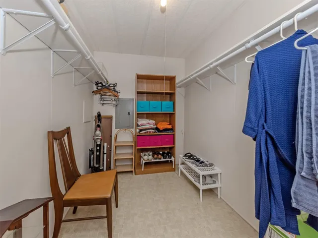 Primary bedroom walk-in closet