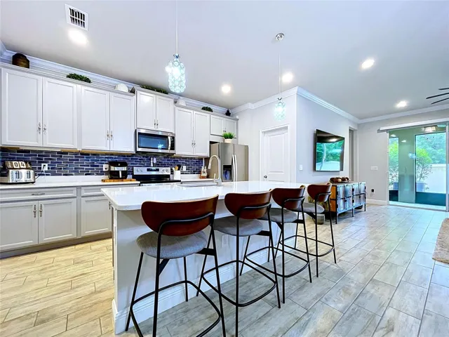 Thoughtfully designed for today's lifestyle, the kitchen opens effortlessly to the living area, allowing conversations and connections to flow naturally throughout the home.