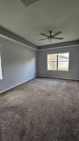 Primary bathroom with old carpet, now it has new vinyl floor