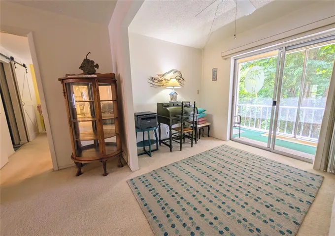 Roll top desk/printer visible here. Entrance to master BR and out on to lanai