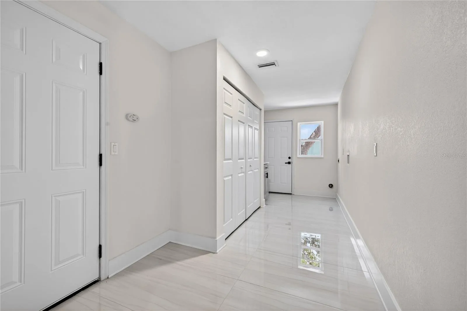 Laundry Room w/ Garage access and door to side yard