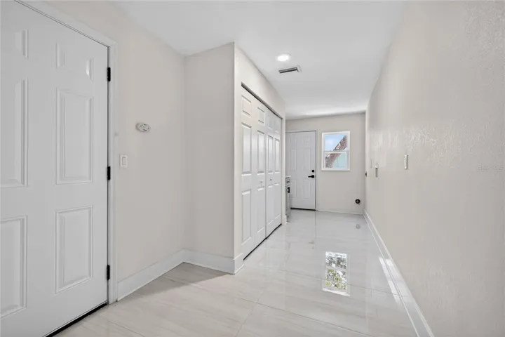 Laundry Room w/ Garage access and door to side yard