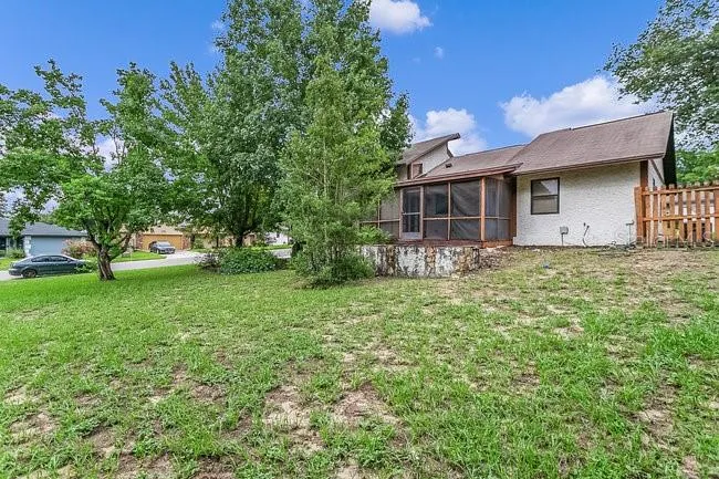 backyard looking at rear of home & patio area