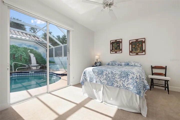 Bedroom 2 with slider to pool