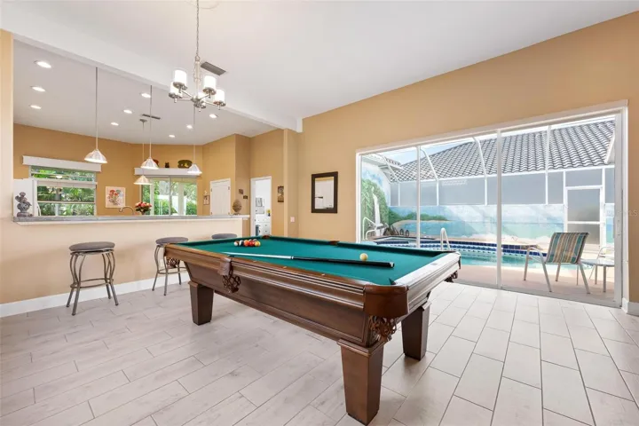 Dining room with slider to pool