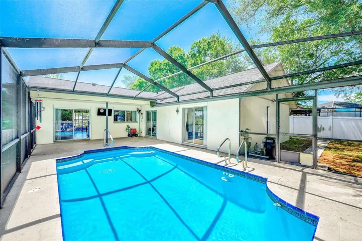 View of inground pool and deck