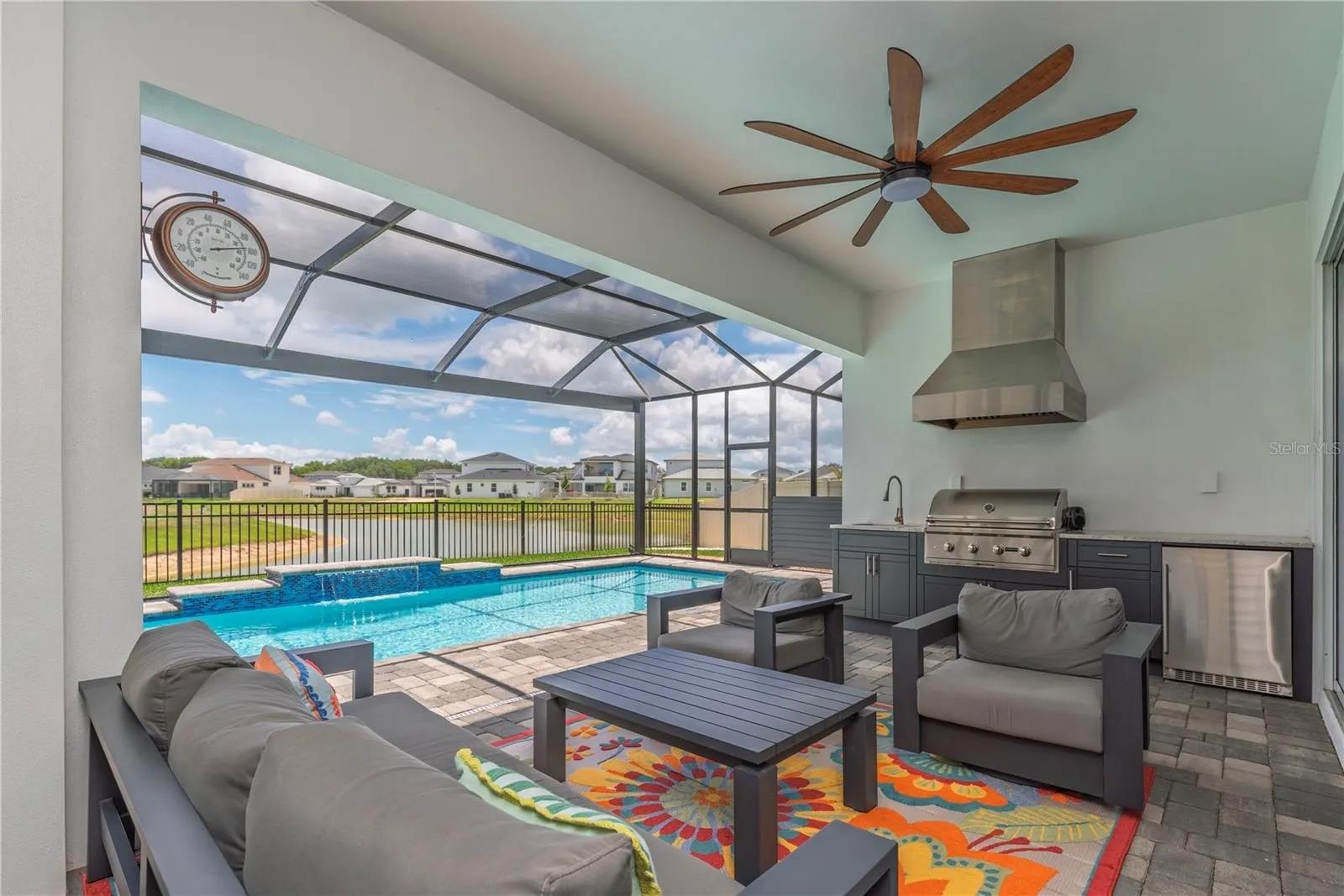 Covered pool lanai with outdoor kitchen.