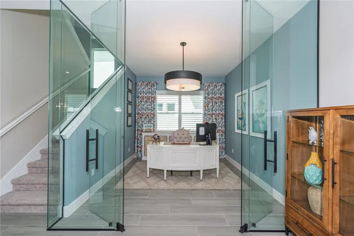 Glass-walled executive office.