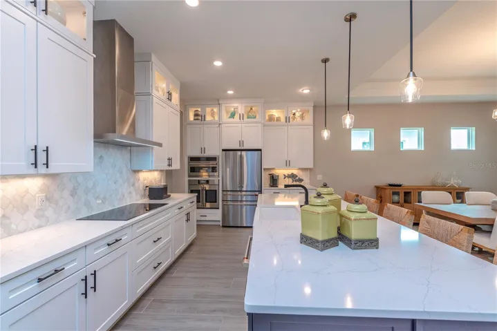 Gourmet kitchen with upgraded quartz counters.