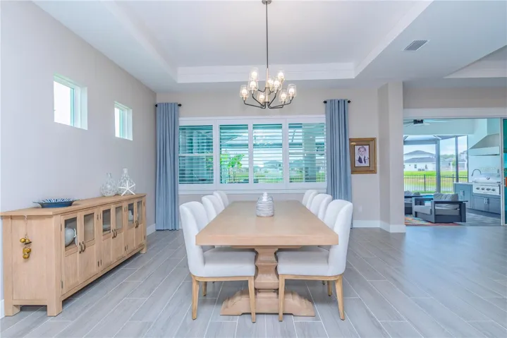 Dining room with view to lanai and water.