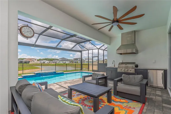Covered pool lanai with outdoor kitchen.