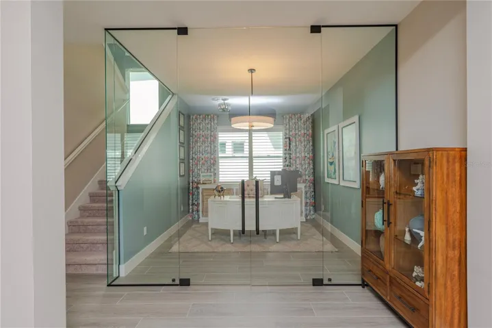 Glass-walled executive office.