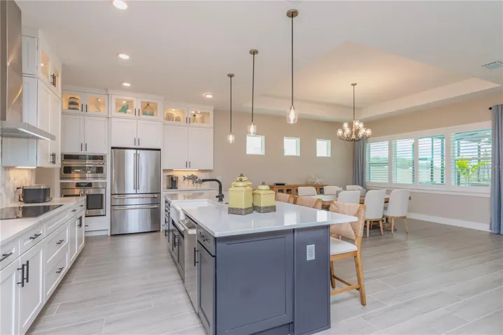 Gourmet kitchen with upgraded stainless steel appliances.