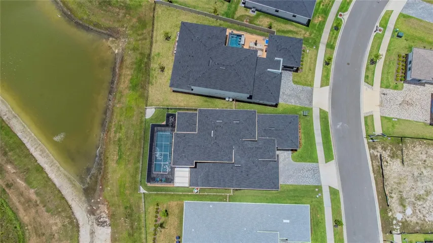 Aerial view of the home and water view.