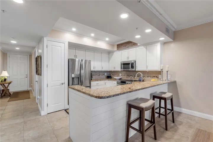 Eat in breakfast bar area with shiplap under bar