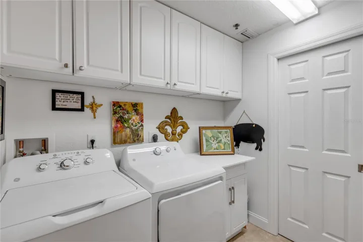 Indoor Laundry closet with sink and extra storage there are only 5 units in each building with this laundry room