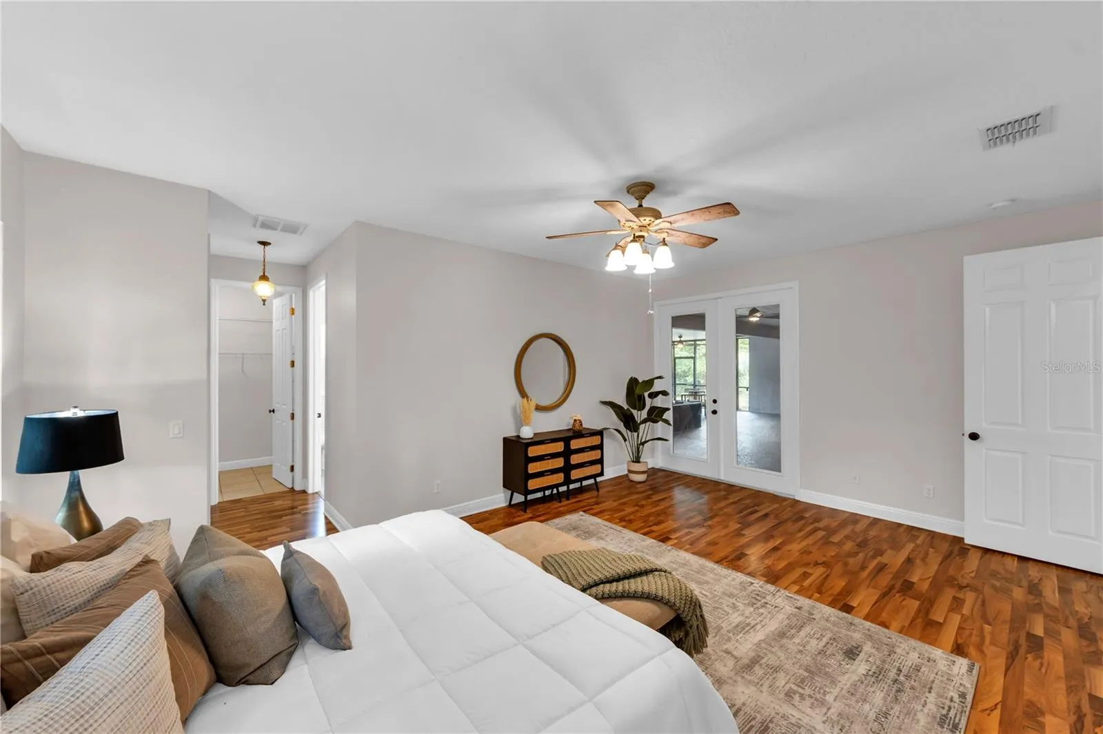 Primary Bedroom with French Doors leading to back porch