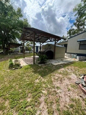 Another car port area for your golf cart or sitting area