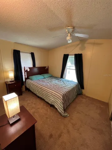Primary bedroom with queen bed. Furnished