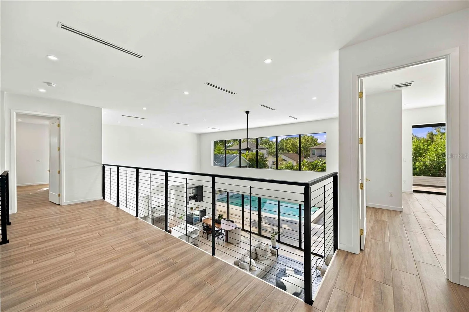 Balcony with 5th bedroom to the right and 2nd primary to the left