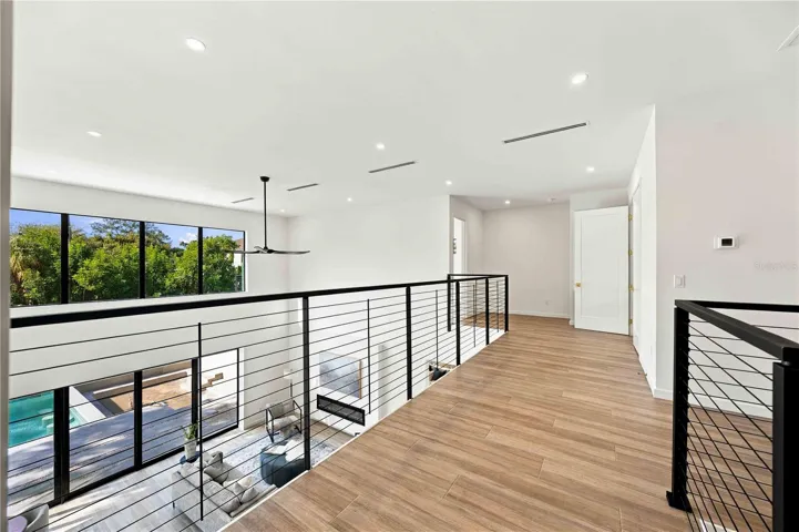 Large 2nd story balcony area w/ access to 4 ensuite bedrooms upstairs