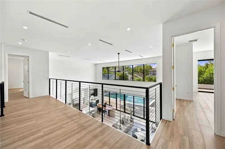 Balcony with 5th bedroom to the right and 2nd primary to the left