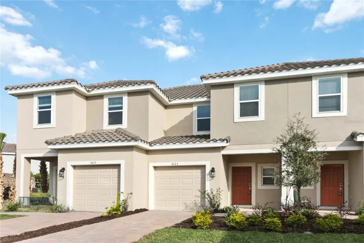 Front Exterior features barrel tile roof, brick paved driveway, front porch and one car garage.