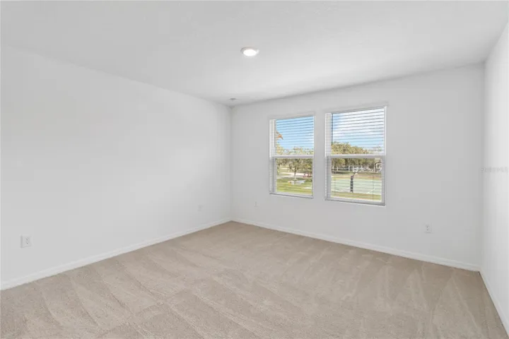 Primary Bedroom with recessed lighting.