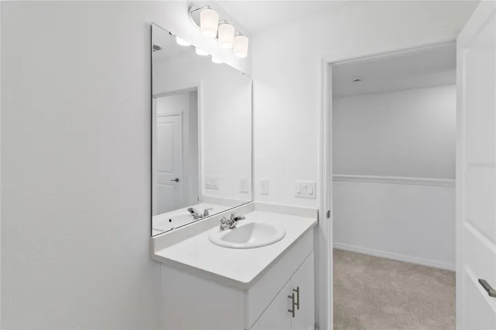 Alternate view of Guest Bathroom with Quartz counters.