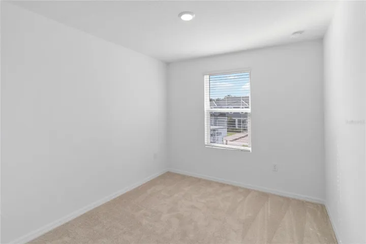 Guest Bedroom two with recessed lighting.