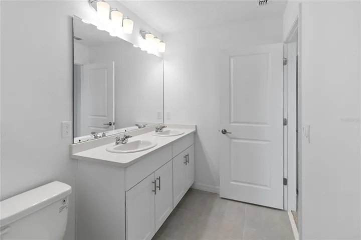 Primary Bathroom with double vanity with Quartz counters.