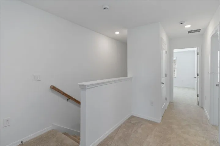 Stairwell leading to second floor. Upstairs Laundry closet with full size Washer and Dryer at top of the stairwell (not shown in this pic.)