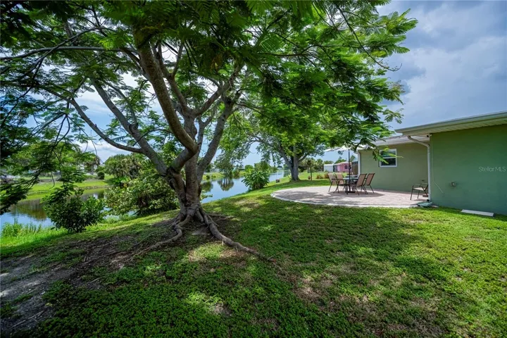Canal Side Patio Surrounded by Mature Shade trees