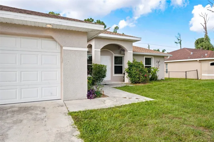 Welcoming Covered Front Entrance with Arched Architectural Details.
