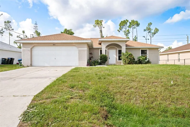 Beautiful Curb Appeal with Spacious Driveway and Two-Car Garage.