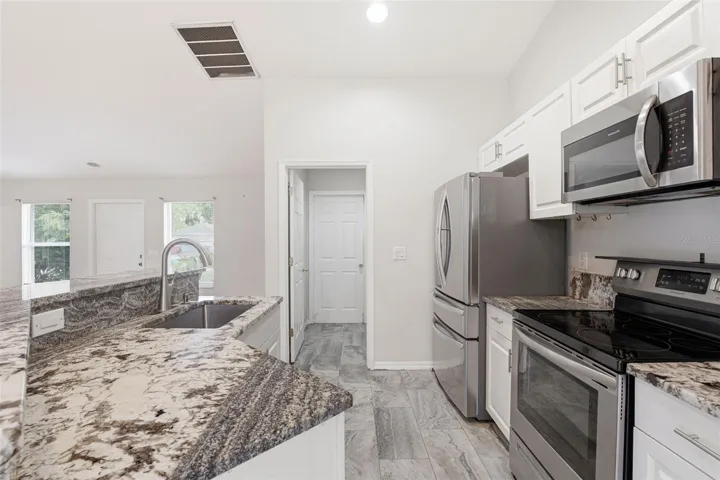 Updated Kitchen with Granite Countertops and Stainless Steel Appliances.