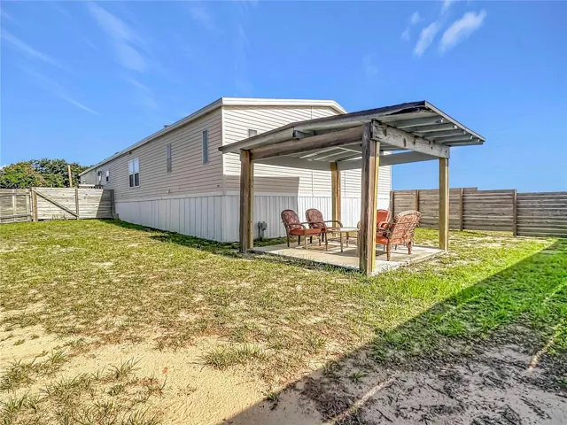 Backyard view with sitting area.