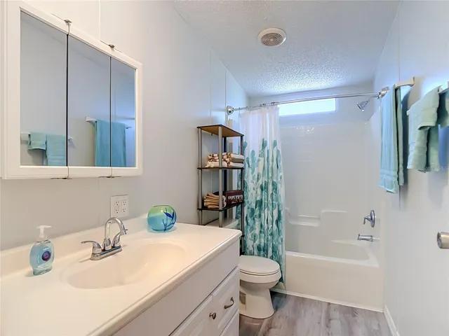 Guest bath has a tub/shower combination.