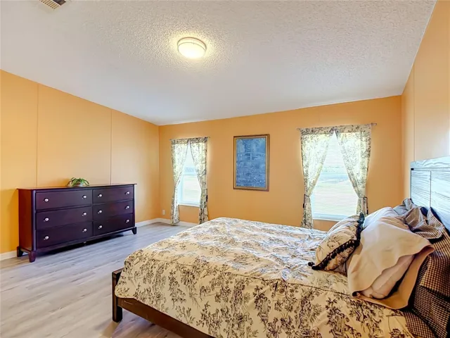 2 large windows in this 15'4" x 14'8" bedroom allow plenty of natural light.