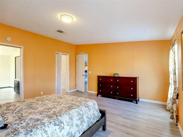 Primary bedroom has ensuite bath and huge walk-in-closet.