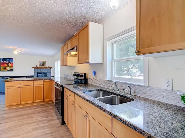 Plenty of storage in this 13'7" x 14'5" kitchen with window over the sink..