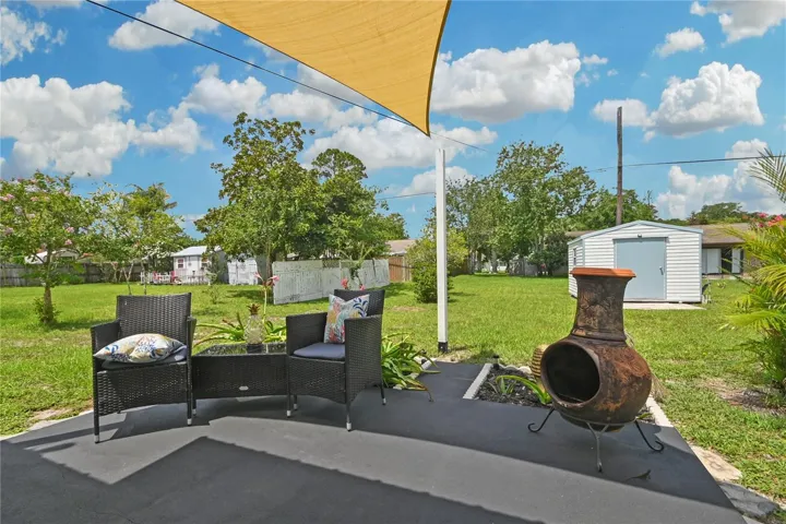 Backyard patio with sunshade.