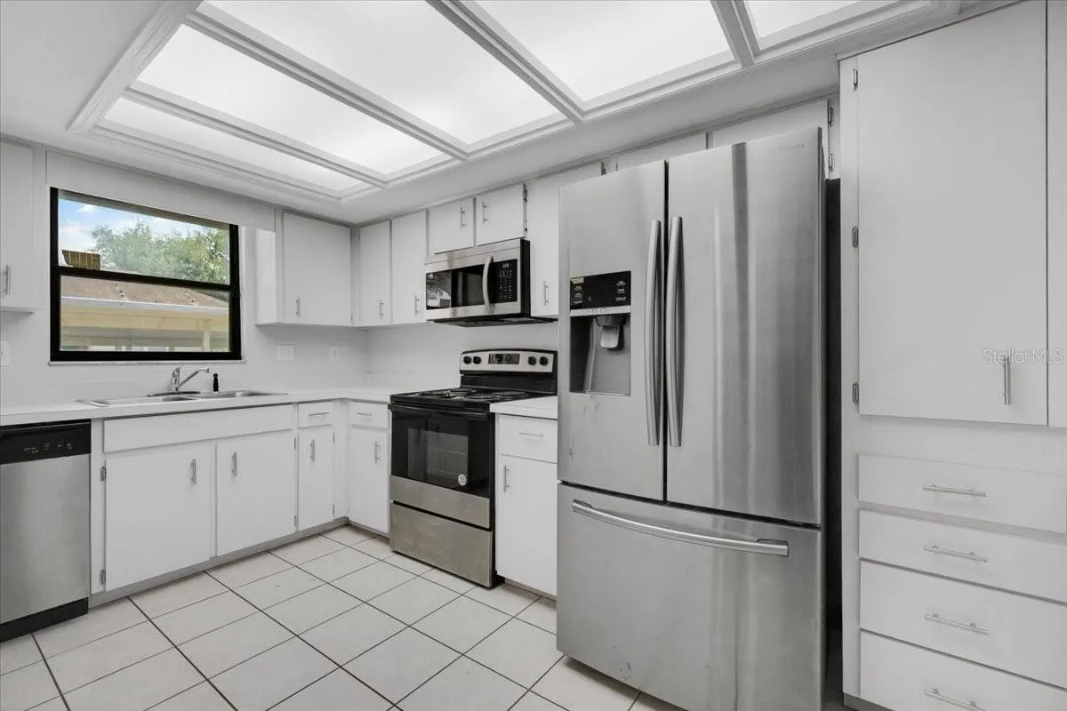 A view into the kitchen with all of the appliances