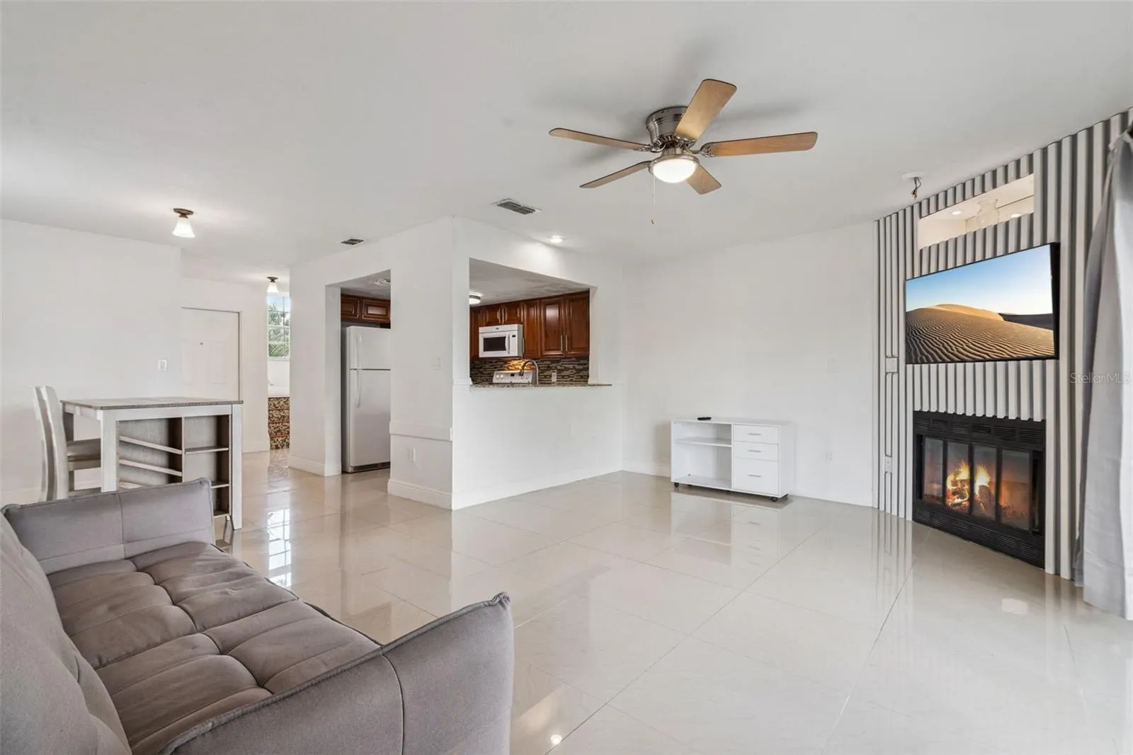 Living Room with view to Dining Room and Kitchen