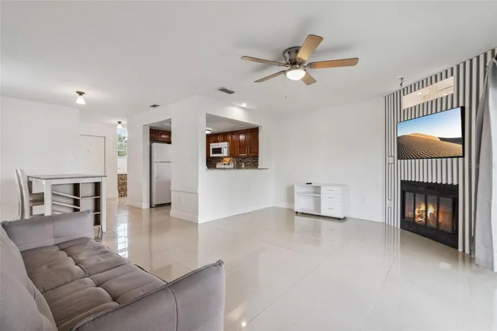 Living Room with view to Dining Room and Kitchen